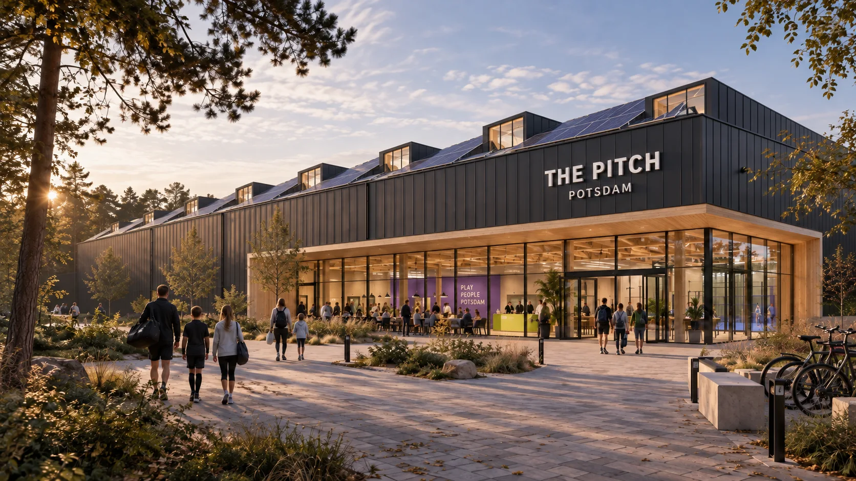 Architekturvision von The Pitch mit Holzfassade und offenem Foyer im Grünen
